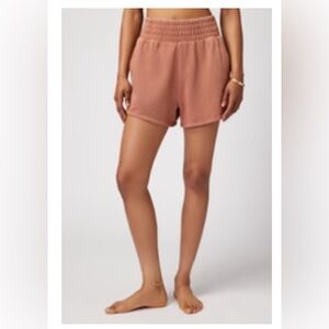 Spiritual Gangster, cotton dolphin shorts, deep rust